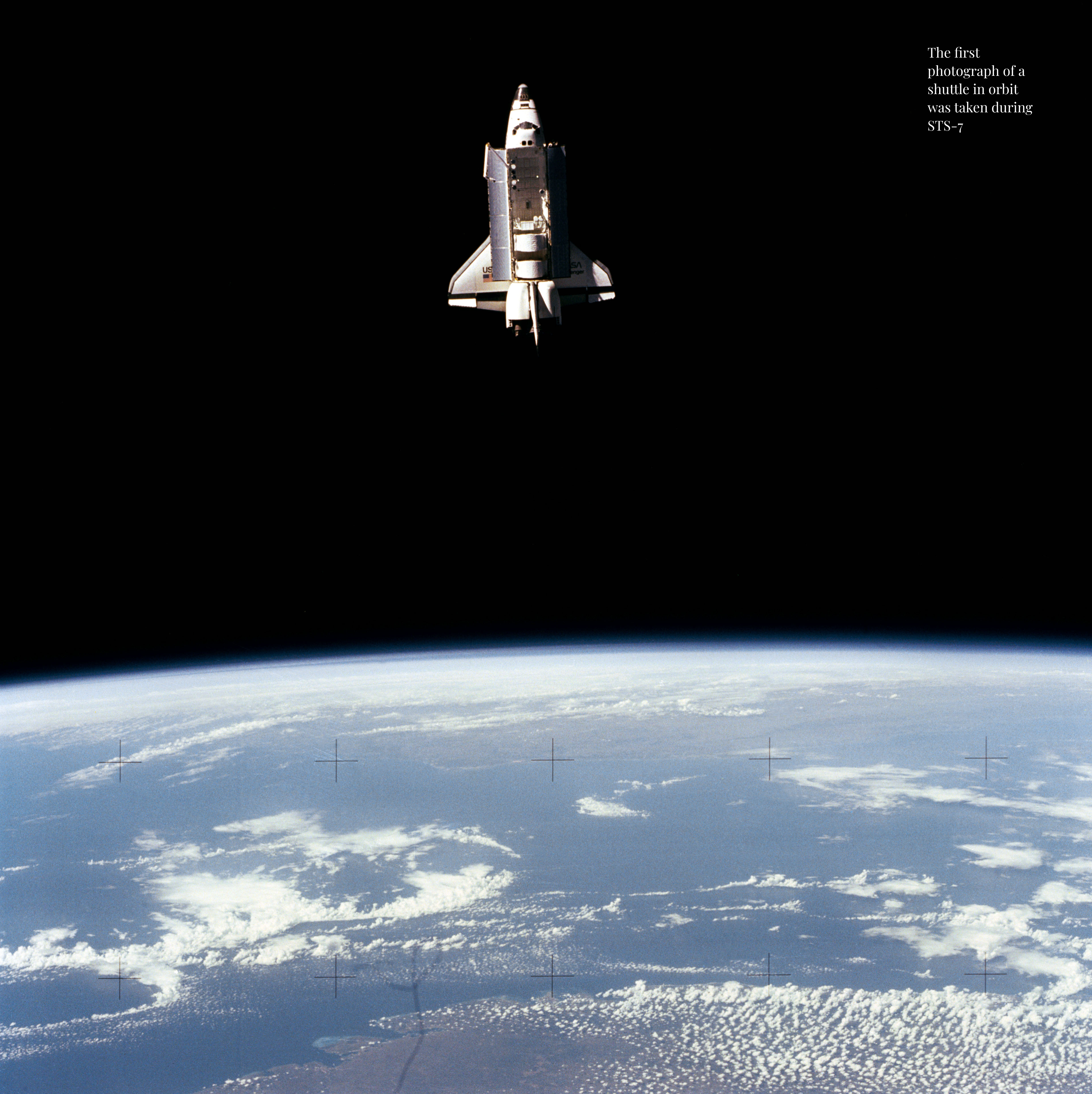 Challenger floating against a black background with Earth horizon seen below